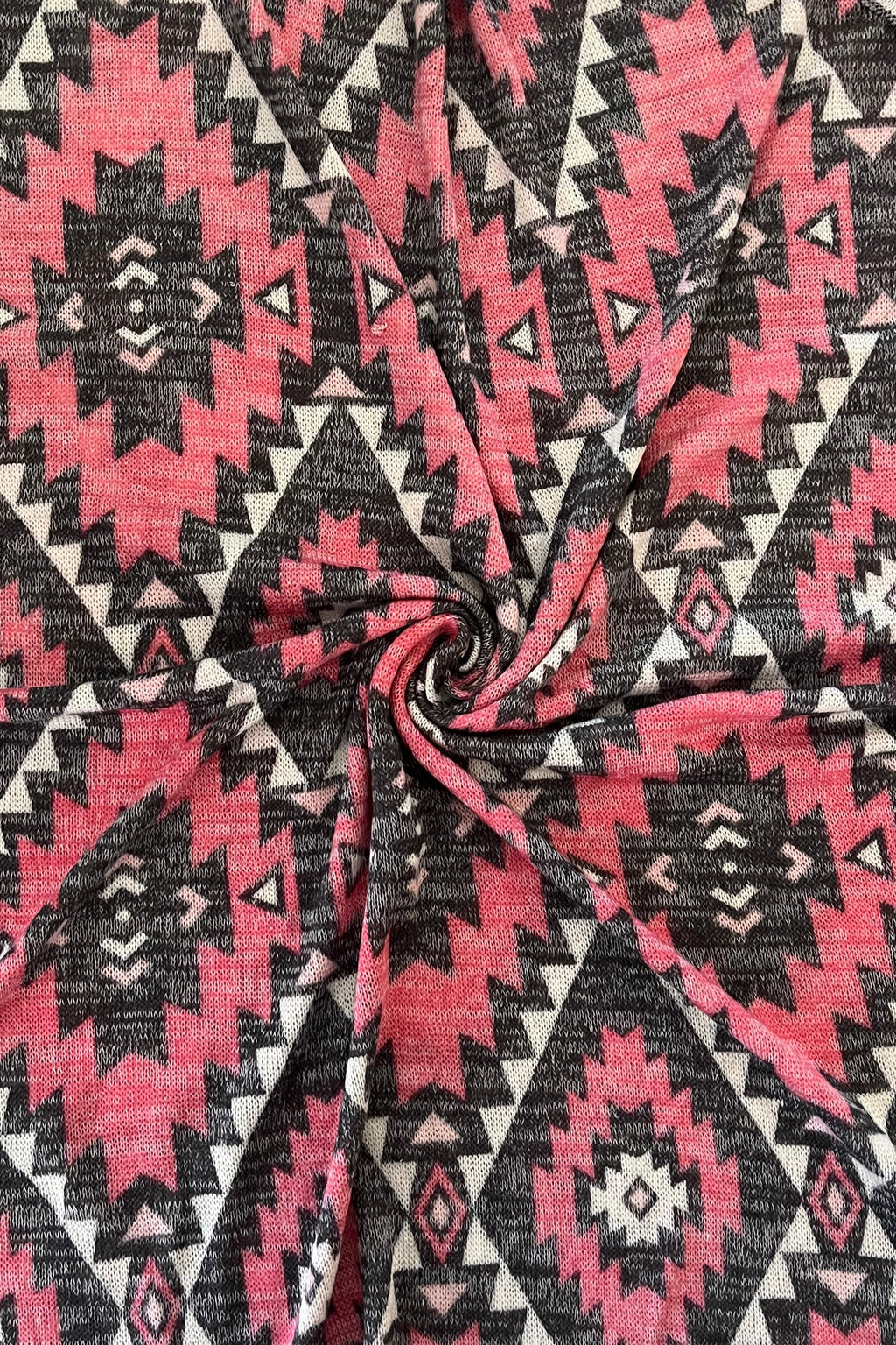 Pink and black geometric patterned fabric