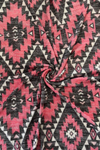 Pink and black geometric patterned fabric