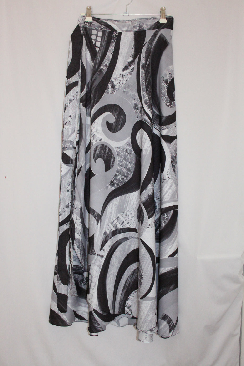 Black and white patterned fabric skirt on a white background