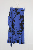 Blue fabric with black floral pattern on a white background