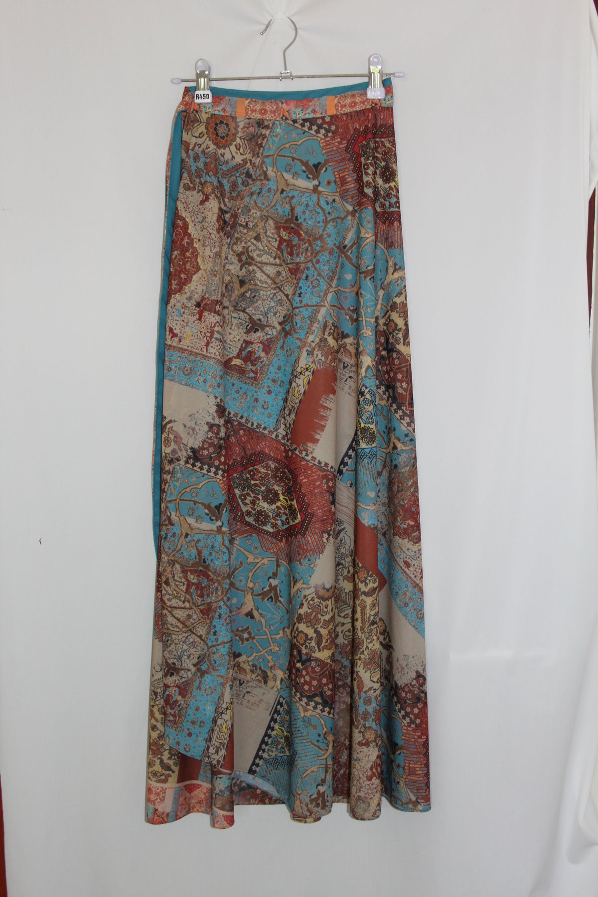 Roll of patterned fabric on a white background