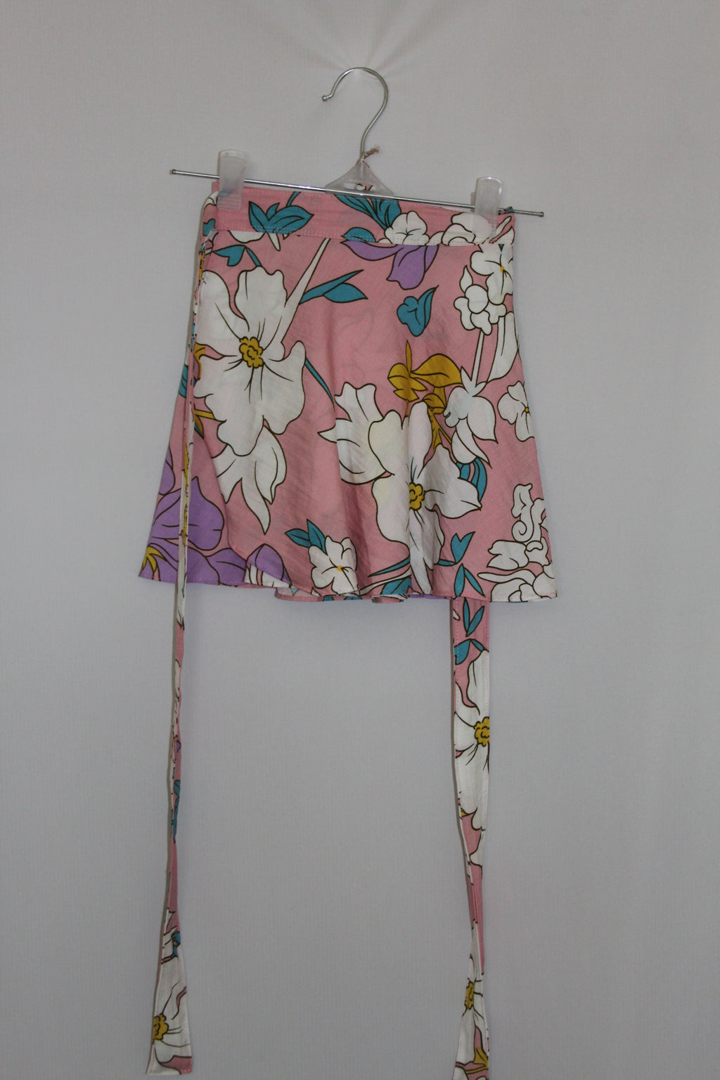 pink floral mini skirt on a white background
