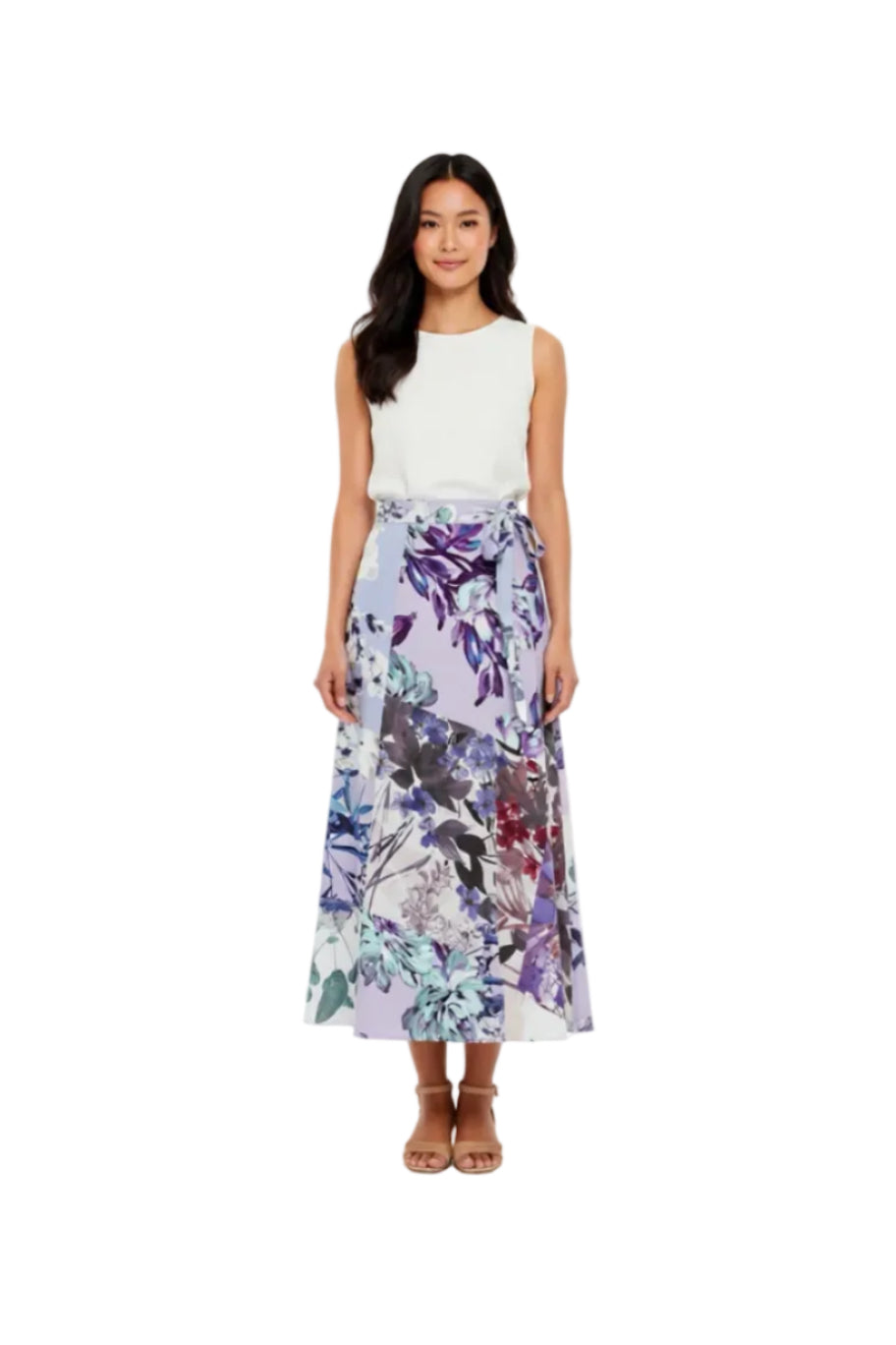 Woman wearing a white top and purple. floral skirt on a white background